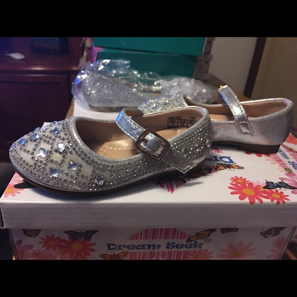 flat little girls dress shoes with a strap.